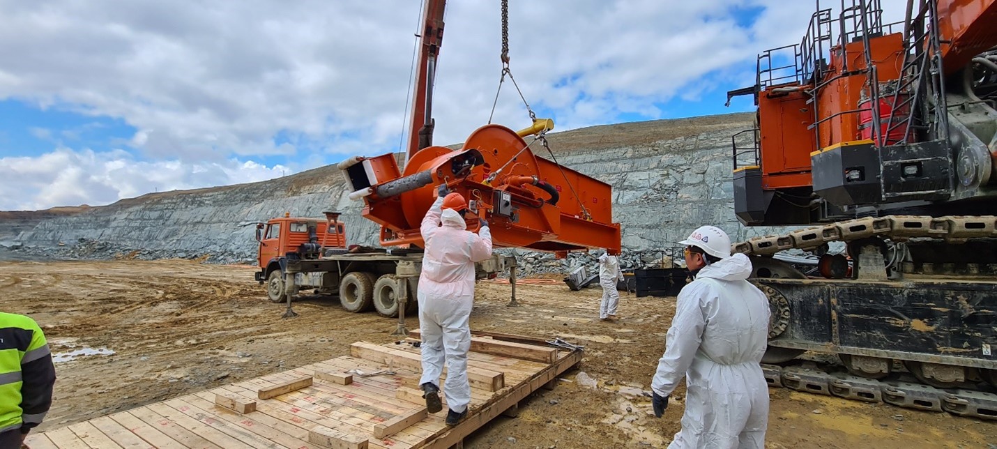 Installing electrical cable reeler on Hitachi excavator 