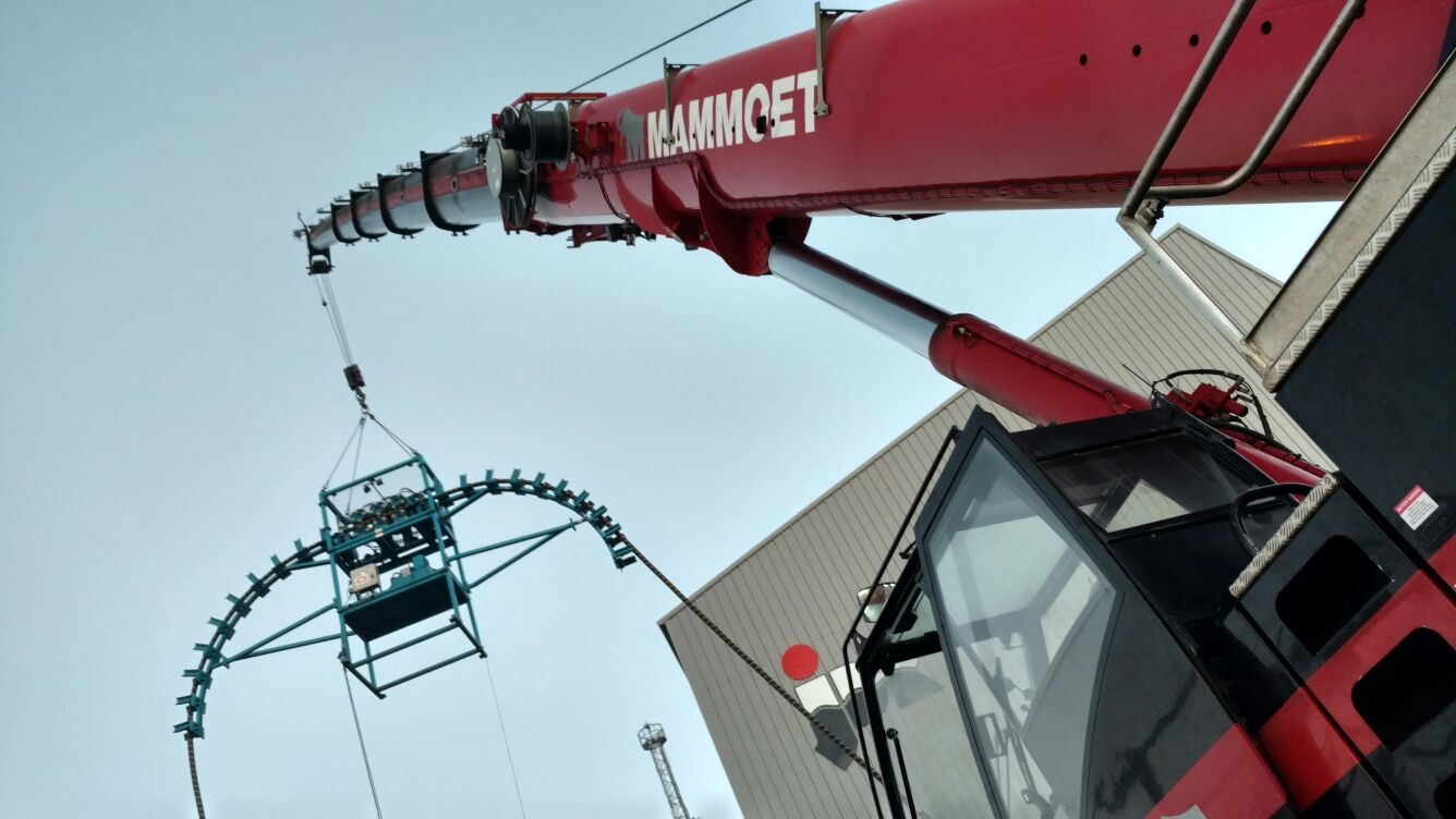 Blue powered quadrant hanging from crane