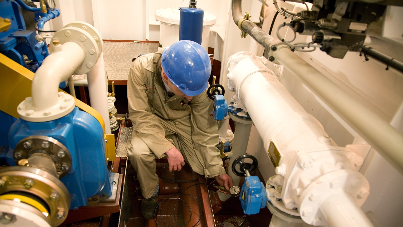 Service engineer for efficient maintenance Mechanic inside vessel doing maintenance