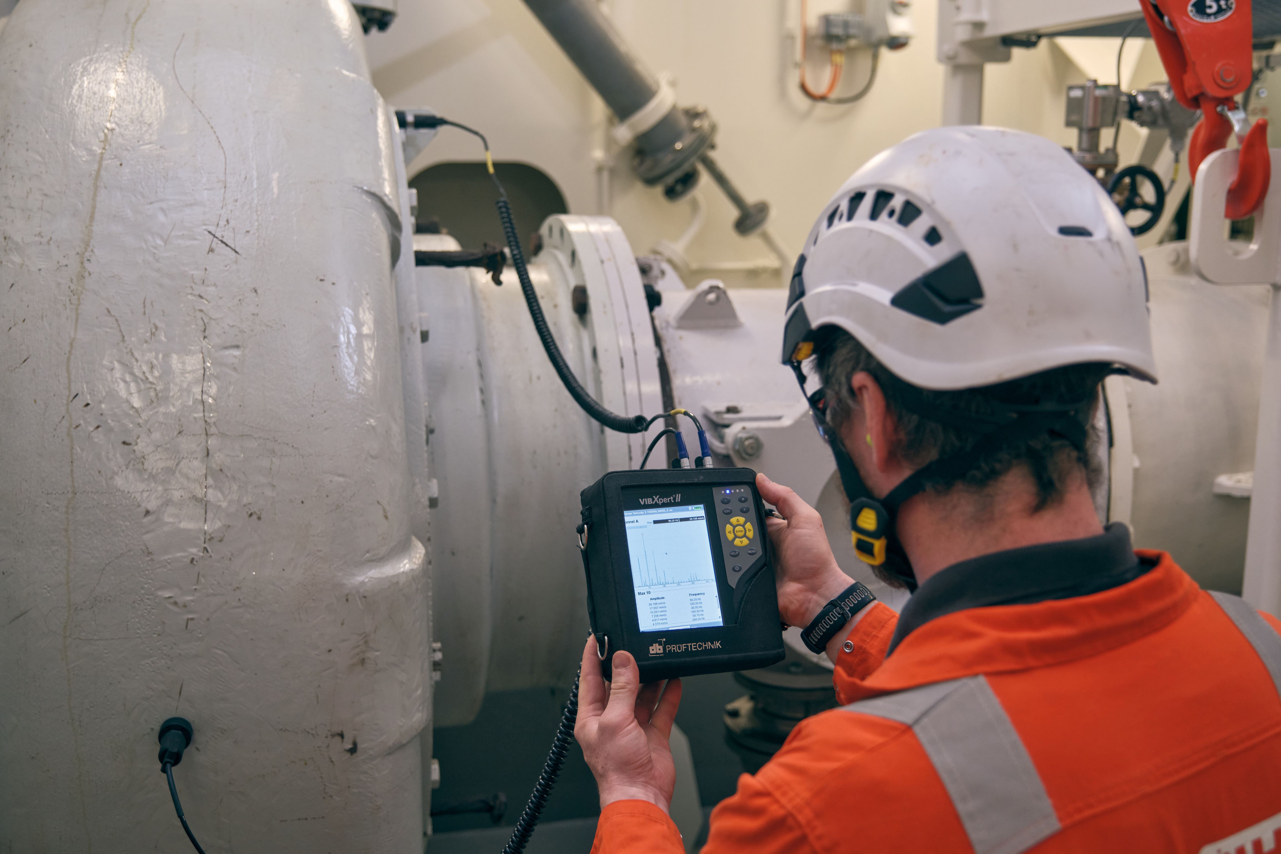 Specialist doing measurement on board