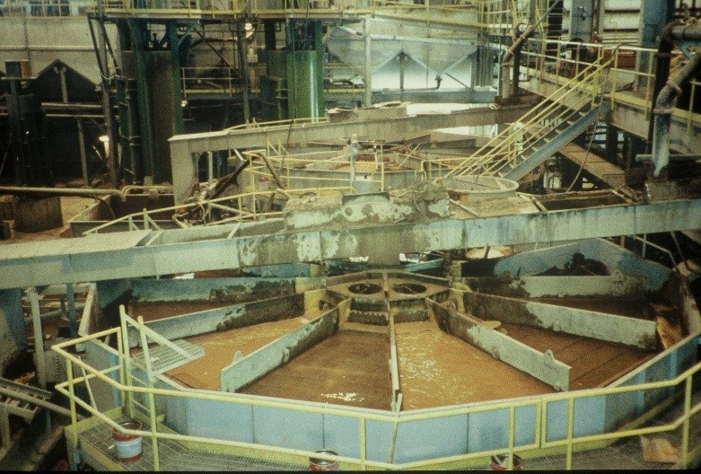 two full circular IHC Mining jigs installed in a ball mill circuit in a hard rock gold operation. The jigs are used to separate coarser gold from the mill discharge.